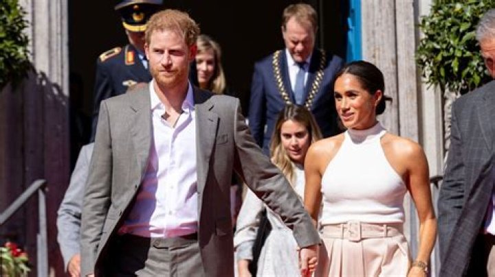 Queen Elizabeth Reportedly Had Meghan Markle And Prince Harry’s Photos Removed From The Palace